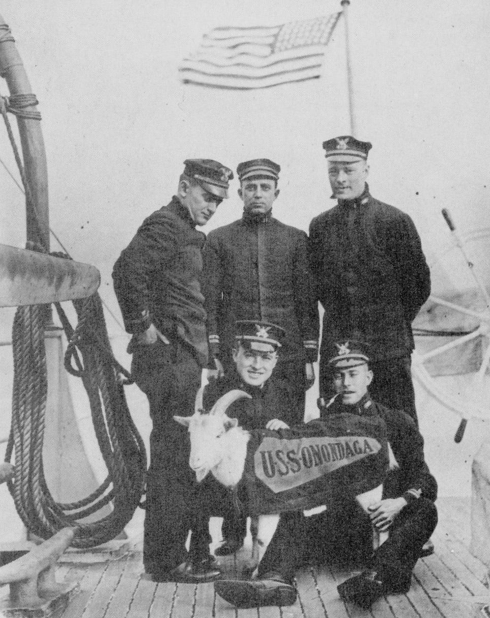 Elmer Stone (standing left) posing with other officers and mascot of Cutter Onondaga. (U.S. Coast Guard) Elmer Stone (standing left) posing with other officers and mascot of Cutter Onondaga. (U.S. Coast Guard)